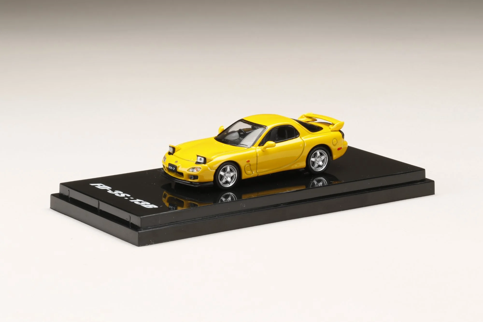 Hobby Japan 1:64 Mazda RX-7 (FD3S) Type RS in Sunburst Yellow with Engine Display Model - Image 2