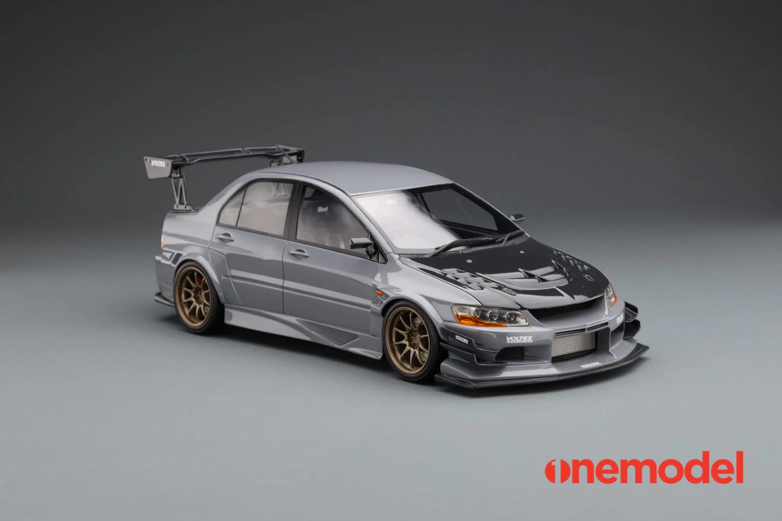 One Model 1:18 Mitsubishi Lancer Evolution IX Voltex with Carbon Bonnet in Cement Gray - Image 3