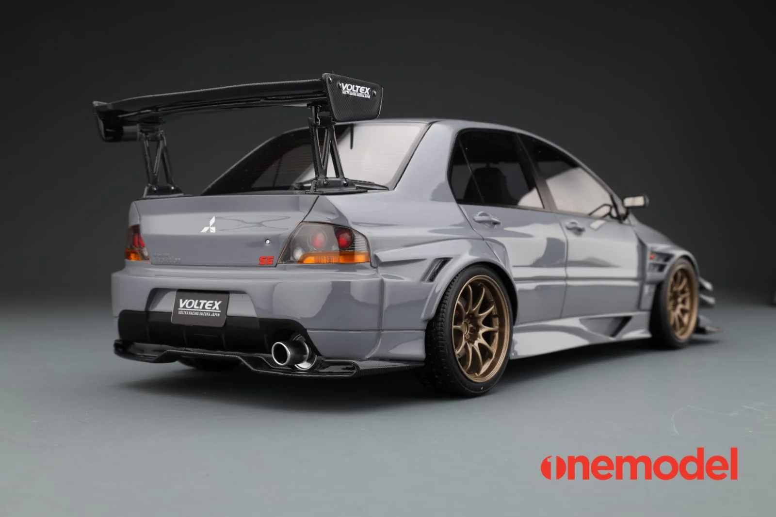 One Model 1:18 Mitsubishi Lancer Evolution IX Voltex with Carbon Bonnet in Cement Gray - Image 7