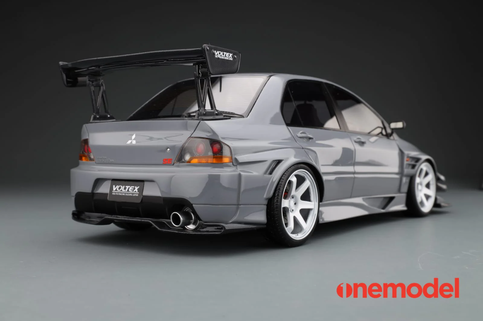 One Model 1:18 Mitsubishi Lancer Evolution IX Voltex with Carbon Bonnet in Cement Gray - Image 9