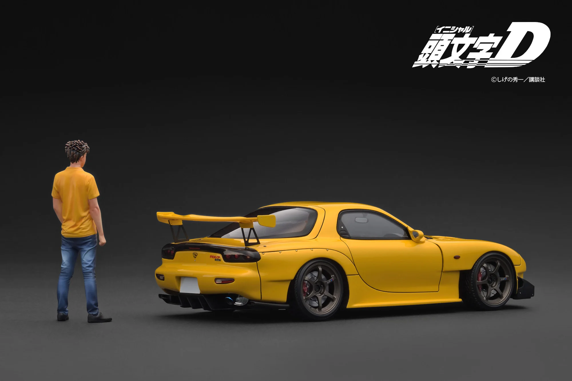 Ignition Model 1:18 Initial D Mazda RX-7 (FD3S) Yellow with Mr. Keisuke Takahashi - Image 2