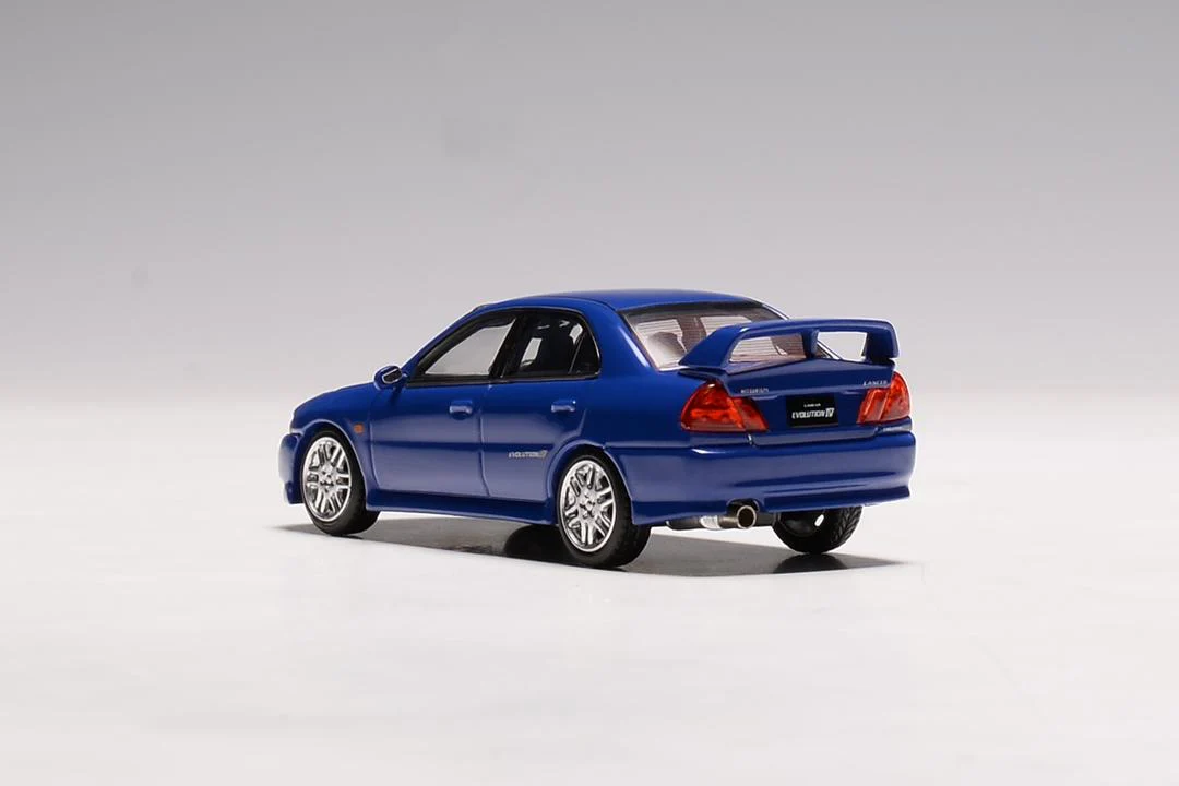MotorHelix 1:64 Mitsubishi Lancer EVO IV in Icelle Blue - Image 2