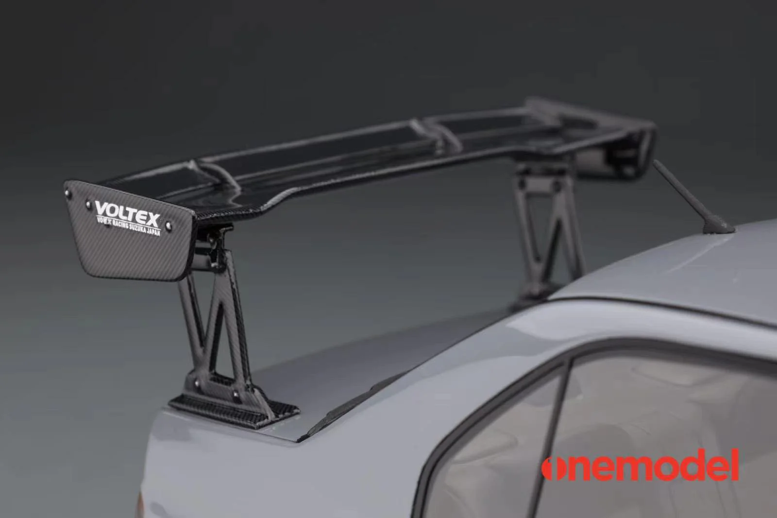 One Model 1:18 Mitsubishi Lancer Evolution IX Voltex with Carbon Bonnet in Iron Gray - Image 5