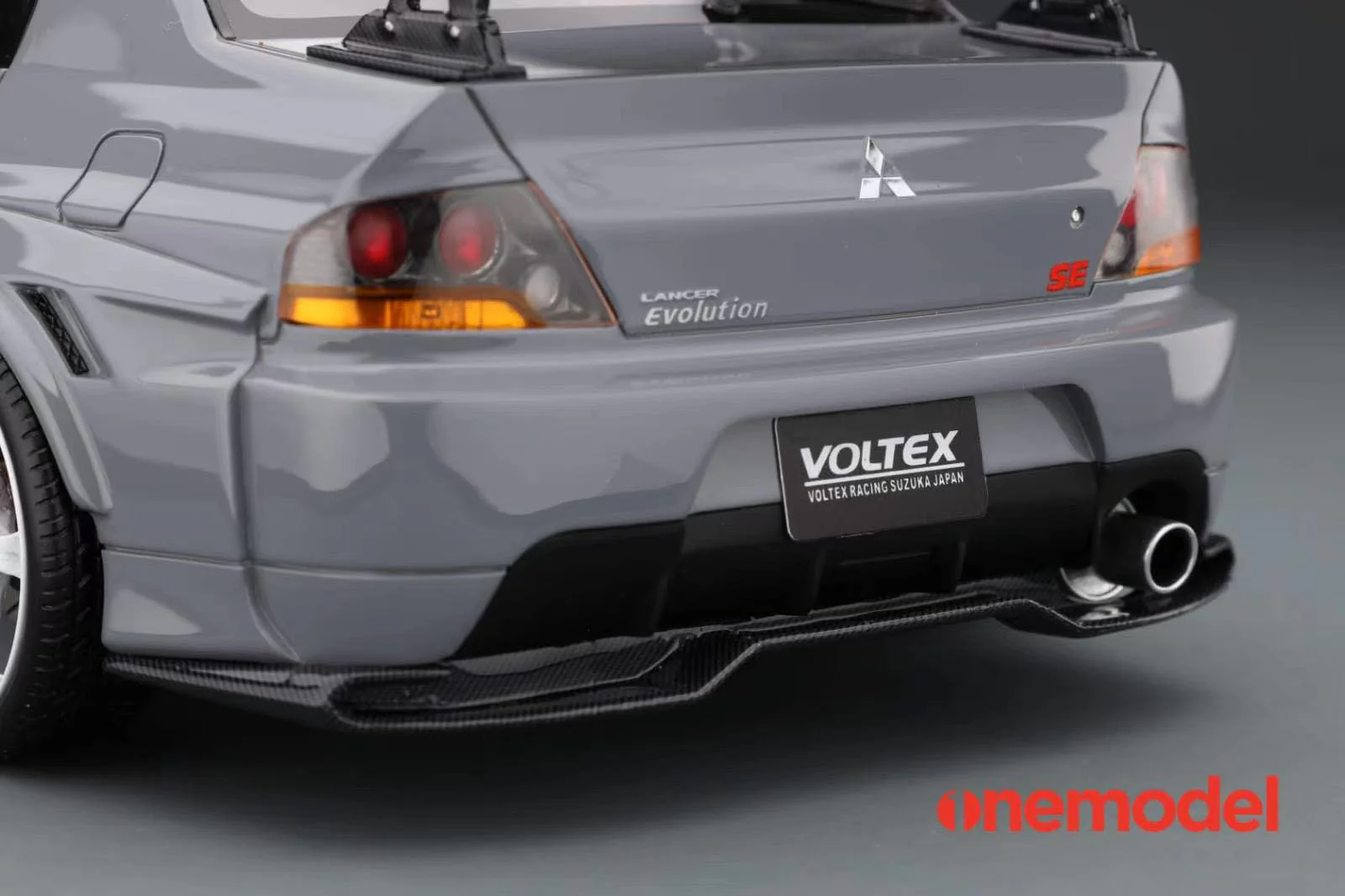 One Model 1:18 Mitsubishi Lancer Evolution IX Voltex with Carbon Bonnet in Iron Gray - Image 7