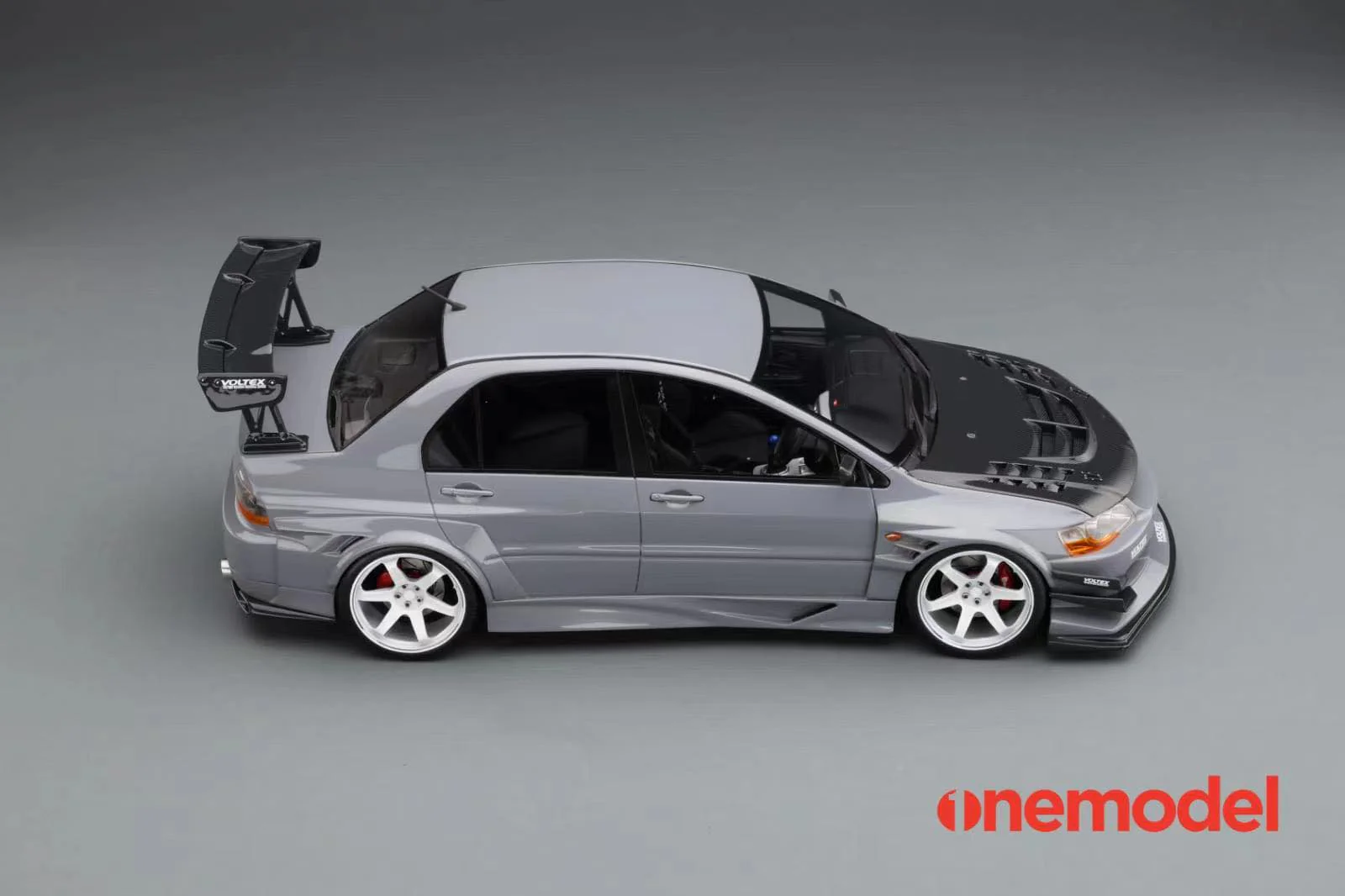 One Model 1:18 Mitsubishi Lancer Evolution IX Voltex with Carbon Bonnet in Iron Gray - Image 8