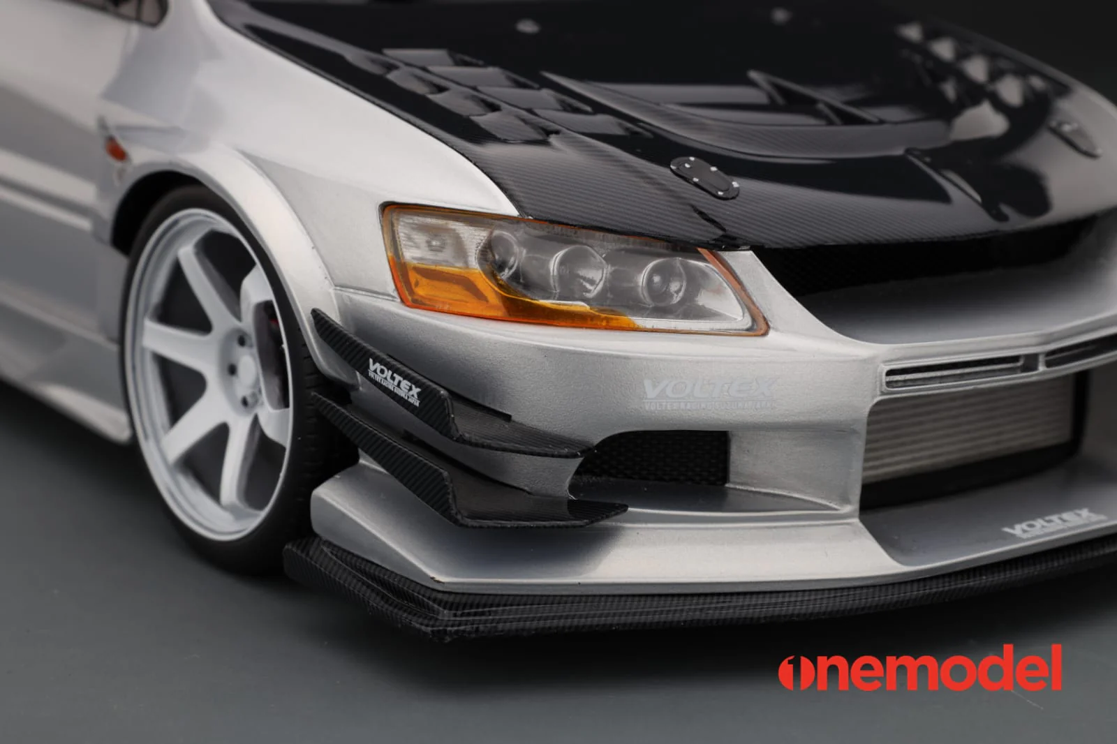 One Model 1:18 Mitsubishi Lancer Evolution IX Voltex with Carbon Bonnet in Silver - Image 2