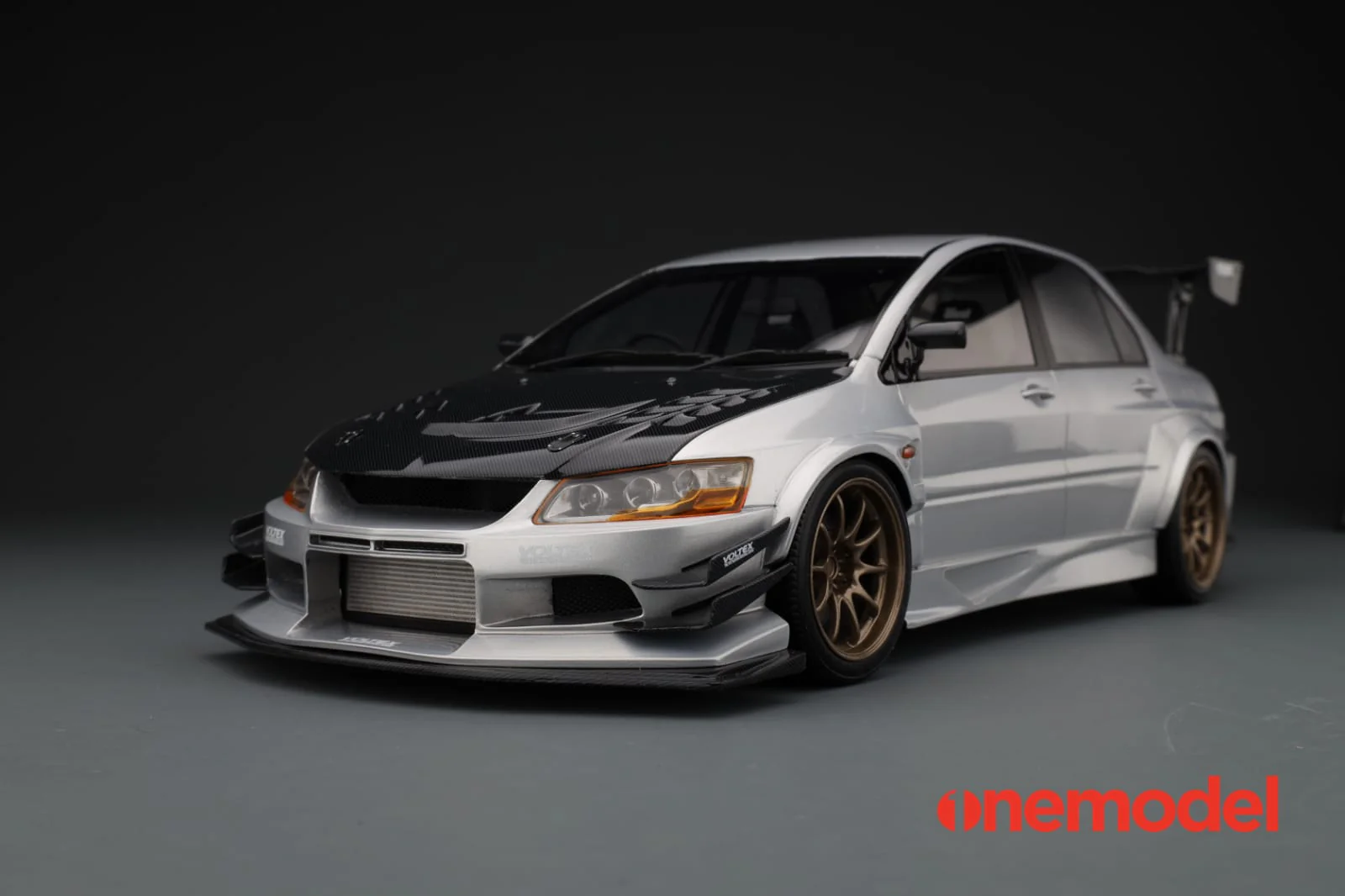 One Model 1:18 Mitsubishi Lancer Evolution IX Voltex with Carbon Bonnet in Silver - Image 6
