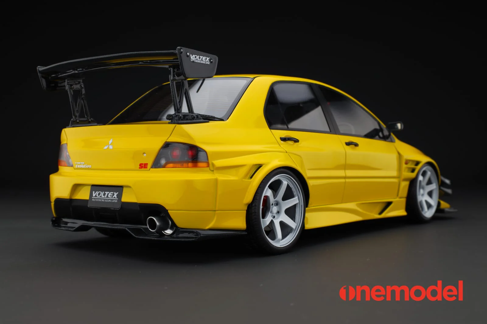 One Model 1:18 Mitsubishi Lancer Evolution IX Voltex with Carbon Bonnet in Yellow - Image 2