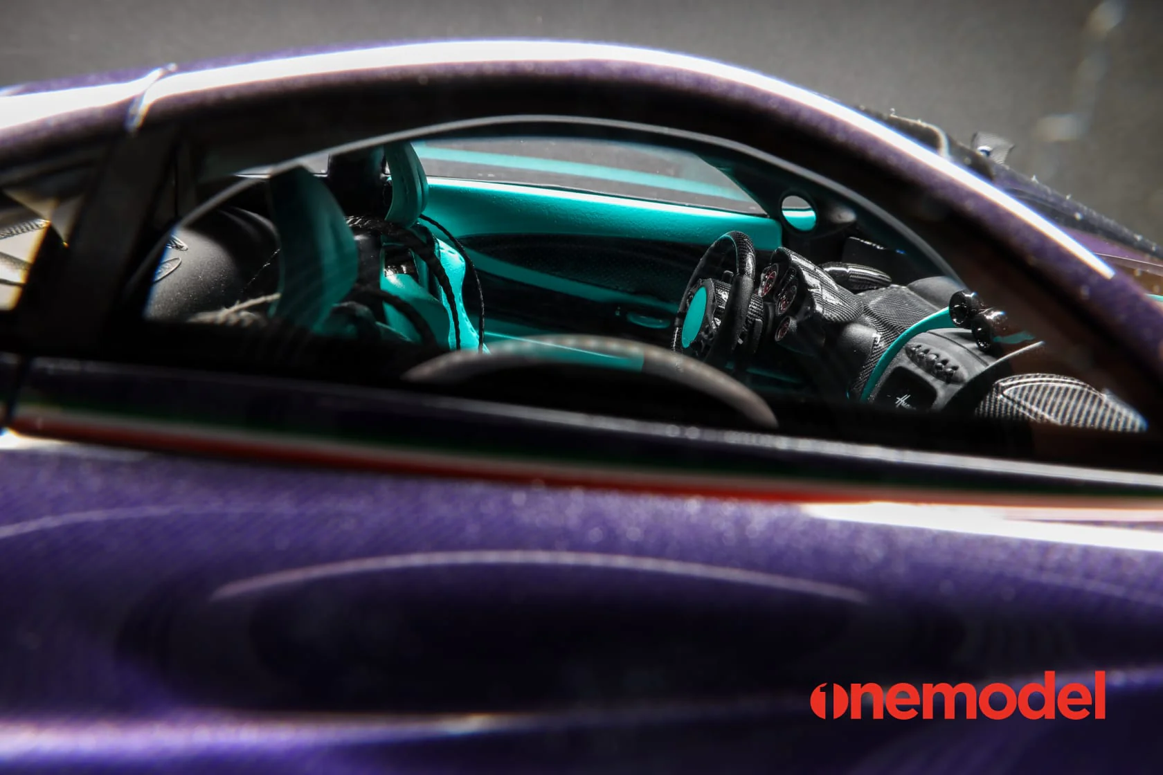One Model 1:18 Pagani Hyuara BC in Carbon Purple with Tiffany Blue Accents - Image 13